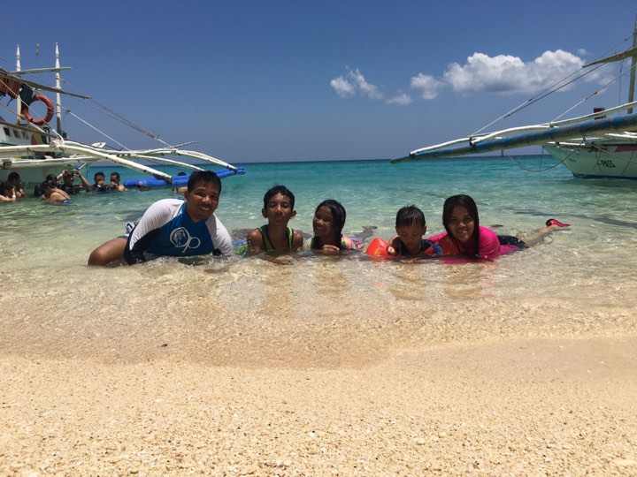 family pic at the Puka Beach